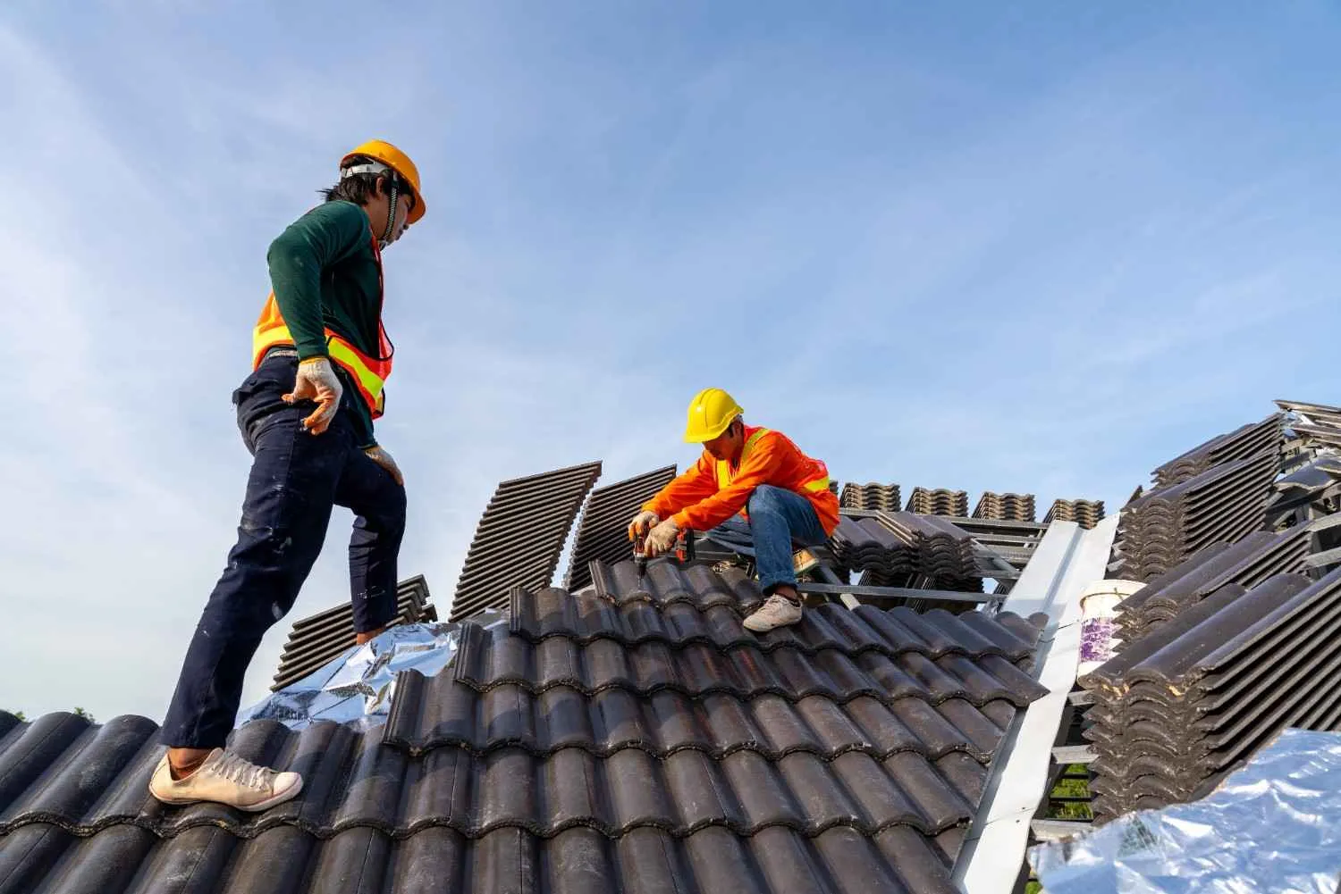 Roof tiles being laid and sealed